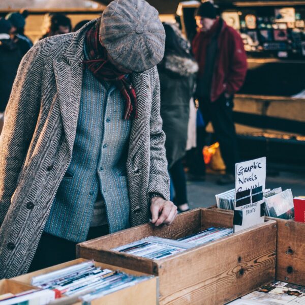 person standing in front of brown crate