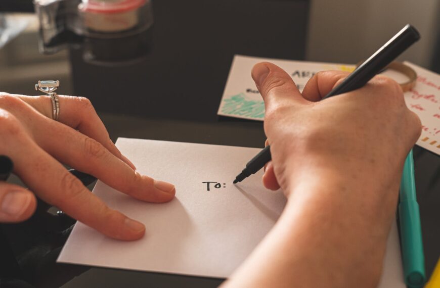 person writing on white paper